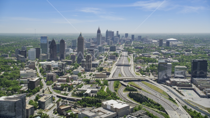 Downtown Connector toward Midtown Atlanta skyscrapers, Georgia Aerial Stock Photo AX36_085.0000162F | Axiom Images