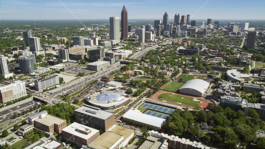 Georgia Institute of Technology with distant Midtown Atlanta skyscrapers, Georgia Aerial Stock Photo AX37_034.0000299F | Axiom Images