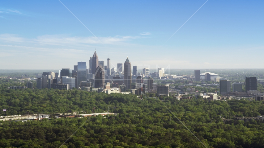 Midtown Atlanta skyscrapers beyond trees, Buckhead, Georgia Aerial Stock Photo AX38_028.0000097F | Axiom Images