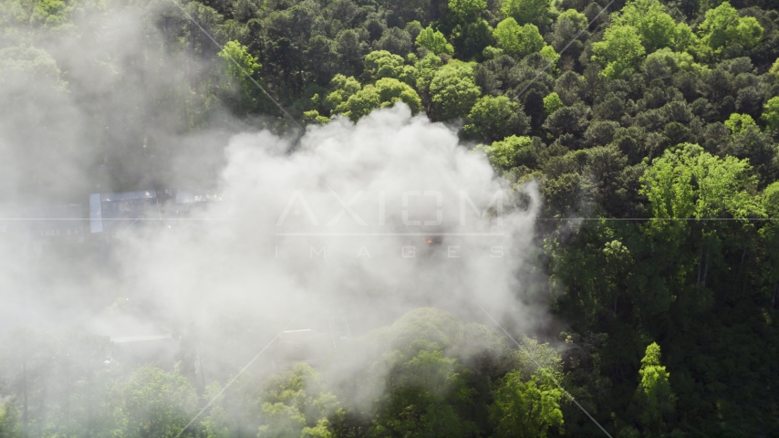 Thick smoke rising from a burning home, West Atlanta, Georgia Aerial Stock Photo AX38_038.0000393F | Axiom Images