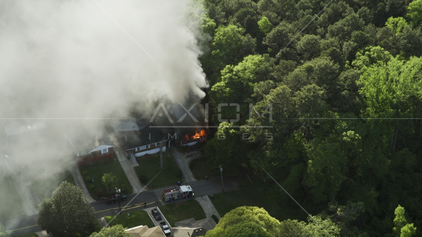 Rising smoke from a burning house, West Atlanta, Georgia Aerial Stock Photo AX38_045.0000458F | Axiom Images