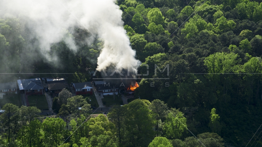 Smoke and flames rising from a burning home, West Atlanta, Georgia Aerial Stock Photo AX38_052.0000129F | Axiom Images