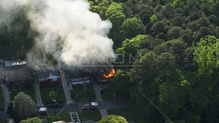 Smoke and flames from a burning home, West Atlanta, Georgia Aerial Stock Photo AX38_052.0000382F | Axiom Images
