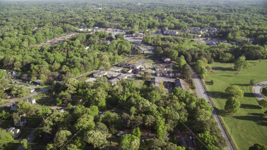 Abandoned buildings among trees, West Atlanta Aerial Stock Photo AX38_082.0000096F | Axiom Images