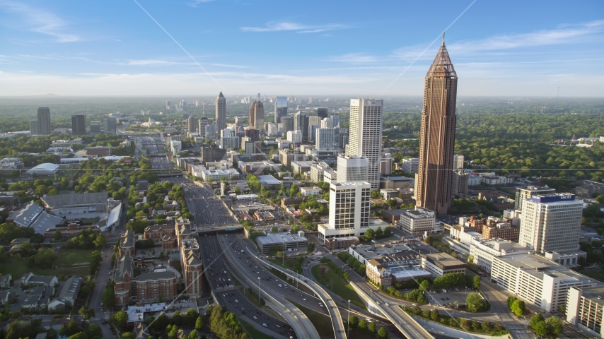 Downtown Connector along city buildings; Midtown Atlanta, Georgia, sunset Aerial Stock Photo AX39_049.0000050F | Axiom Images