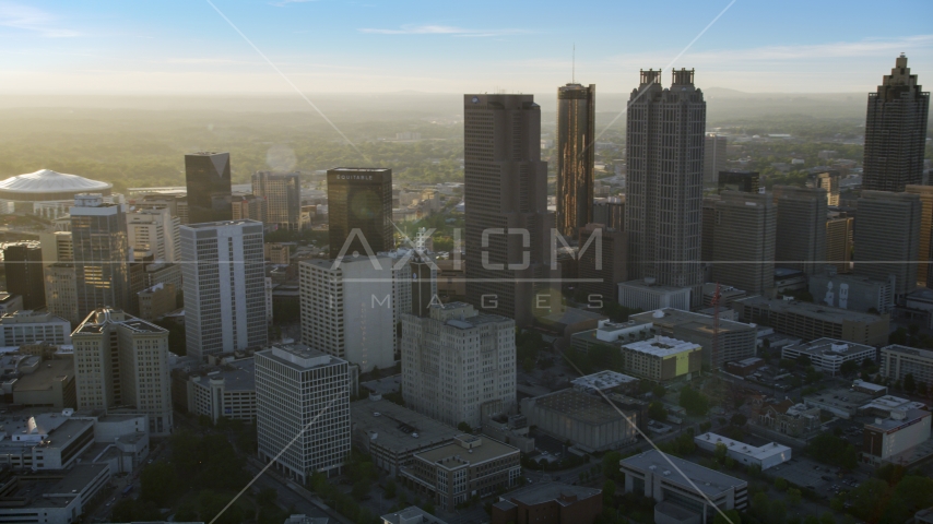 Downtown Atlanta skyscrapers at sunset with hazy skies, Georgia Aerial Stock Photo AX39_066.0000060F | Axiom Images