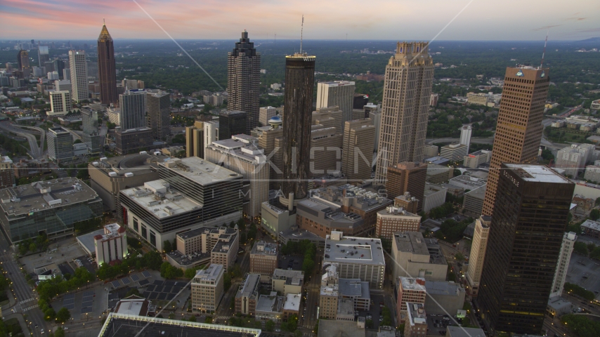 Westin Peachtree Plaza Hotel and skyscrapers in Downtown Atlanta, Georgia, twilight Aerial Stock Photo AX40_004.0000430F | Axiom Images