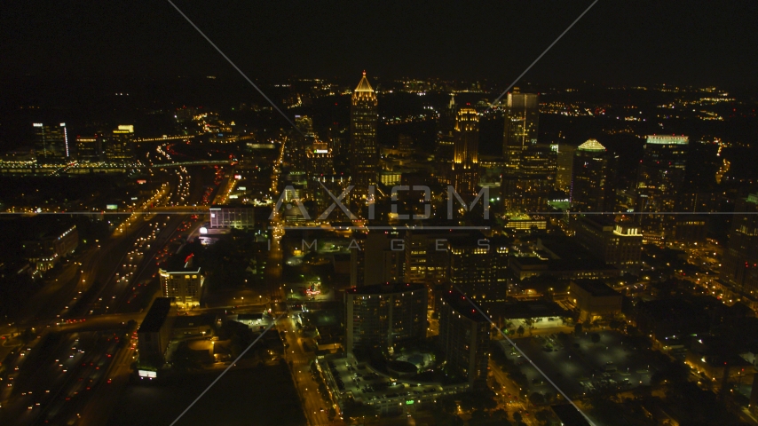 Tall skyscrapers and city buildings in Midtown Atlanta, Georgia, night Aerial Stock Photo AX41_027.0000019F | Axiom Images