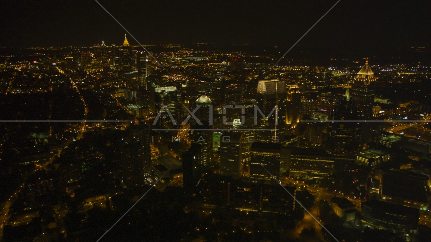 Wide view of skyscrapers and city sprawl, Midtown Atlanta, Georgia, night Aerial Stock Photo AX41_072.0000000F | Axiom Images
