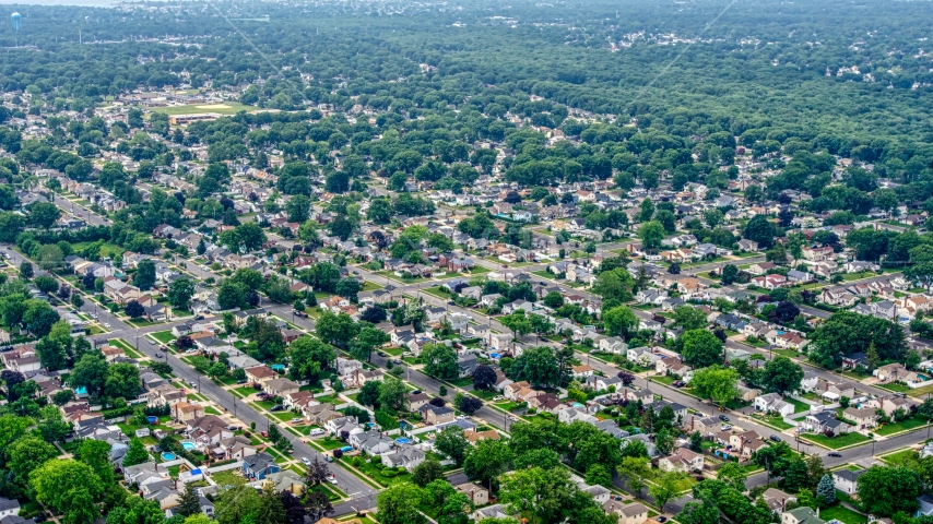 Suburban homes in a Massapequa Park neighborhood, Long Island, New York Aerial Stock Photo AXP071_000_0003F | Axiom Images