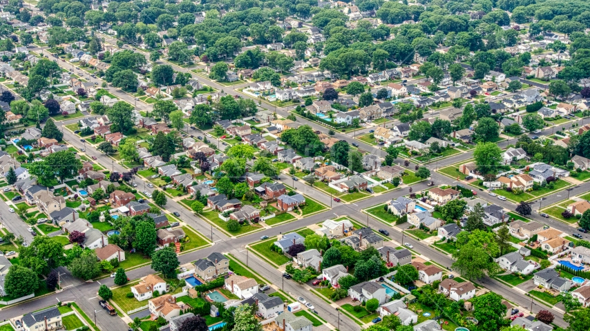 Homes in a Massapequa Park suburban neighborhood, Long Island, New York Aerial Stock Photo AXP071_000_0004F | Axiom Images