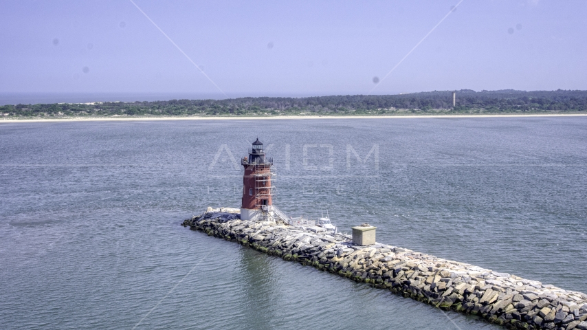 A view of the Delaware Breakwater East End Light and the nearby shore Aerial Stock Photo AXP072_000_0003F | Axiom Images