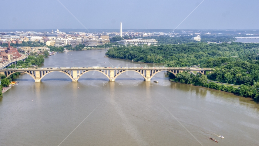 Francis Scott Key Bridge over the Potomac River, Washington Monument in background in Washington DC Aerial Stock Photo AXP075_000_0017F | Axiom Images