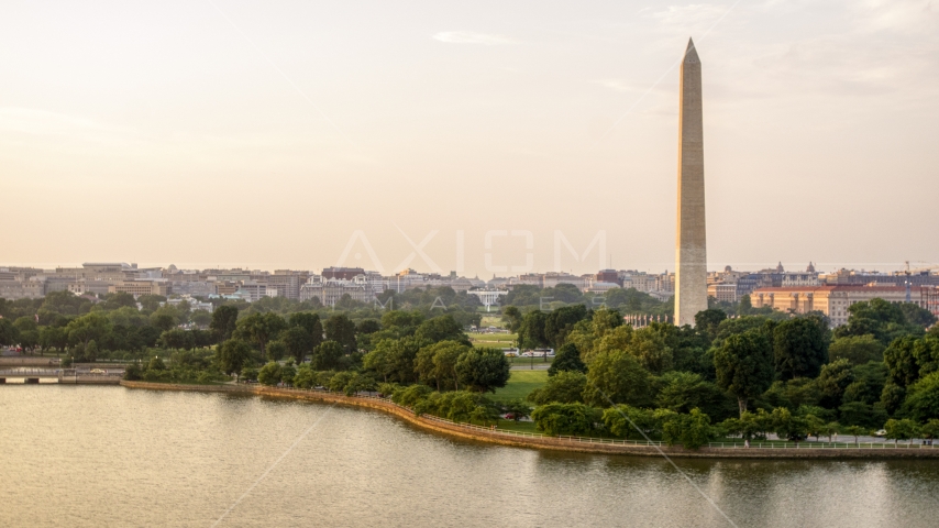 The Washington Monument and White House seen from Tidal Basin, Washington D.C., sunset Aerial Stock Photo AXP076_000_0010F | Axiom Images
