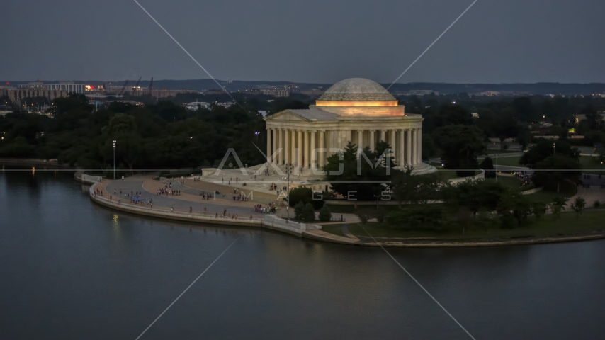 The Jefferson Memorial lit up at twilight in Washington, D.C. Aerial Stock Photo AXP076_000_0035F | Axiom Images