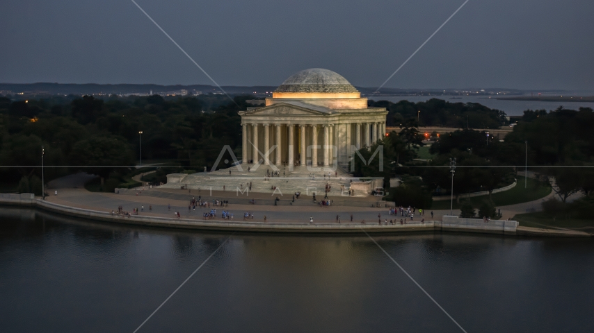 The front of the Jefferson Memorial lit up for the night, Washington, D.C., twilight Aerial Stock Photo AXP076_000_0036F | Axiom Images
