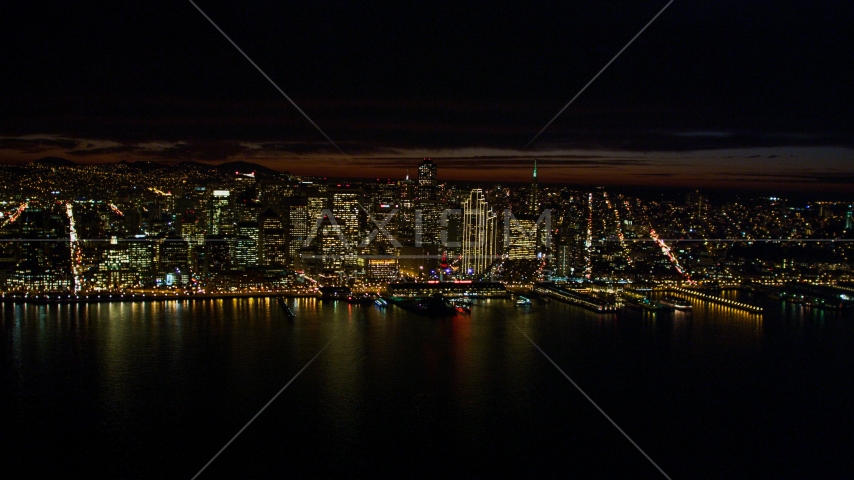 Downtown San Francisco skyscrapers seen from San Francisco Bay, California, night Aerial Stock Photo DCSF06_003.0000210 | Axiom Images