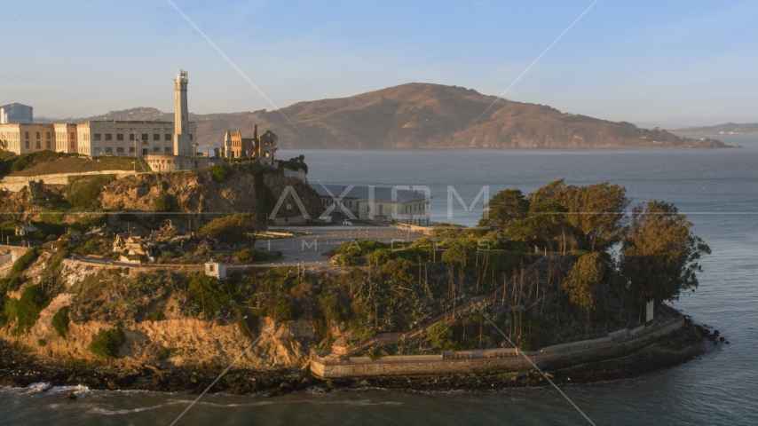Alcatraz lighthouse and part of the island in San Francisco, California, sunset Aerial Stock Photo DCSF07_033.0000000 | Axiom Images