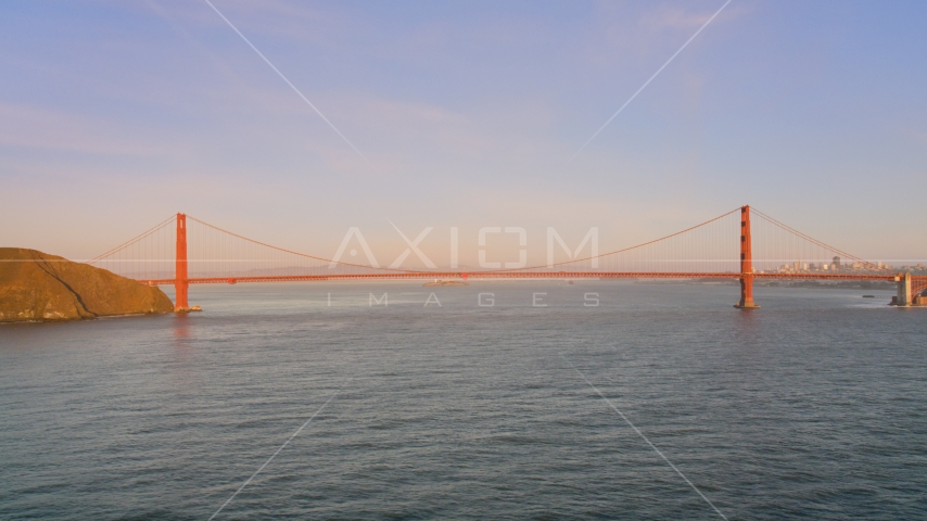 Wide view of the Golden Gate Bridge at sunset in San Francisco, California Aerial Stock Photo DCSF07_047.0000002 | Axiom Images