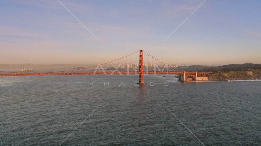 The Golden Gate Bridge with Downtown San Francisco skyline behind it, California, sunset Aerial Stock Photo DCSF07_048.0000059 | Axiom Images