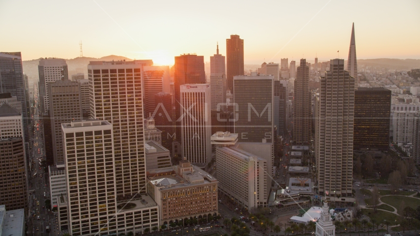 Setting sun behind high-rises and skyscrapers in Downtown San Francisco, California Aerial Stock Photo DCSF07_062.0000368 | Axiom Images