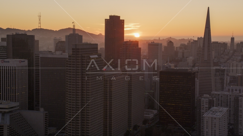Skyscrapers with setting sun in background, Downtown San Francisco, California, sunset Aerial Stock Photo DCSF07_066.0000024 | Axiom Images