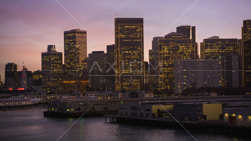 The skyline of Downtown San Francisco seen from piers on the shore, California, twilight Aerial Stock Photo DCSF07_087.0000247 | Axiom Images