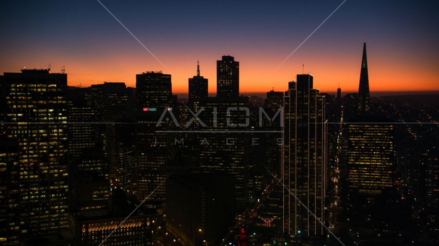 Twilight glow behind skyscrapers in Downtown San Francisco, California Aerial Stock Photo DCSF07_107.0000317 | Axiom Images