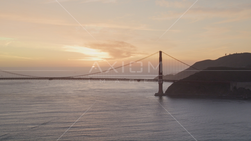 Golden Gate Bridge with setting sun in the distance, San Francisco, California, sunset Aerial Stock Photo DCSF10_026.0000139 | Axiom Images