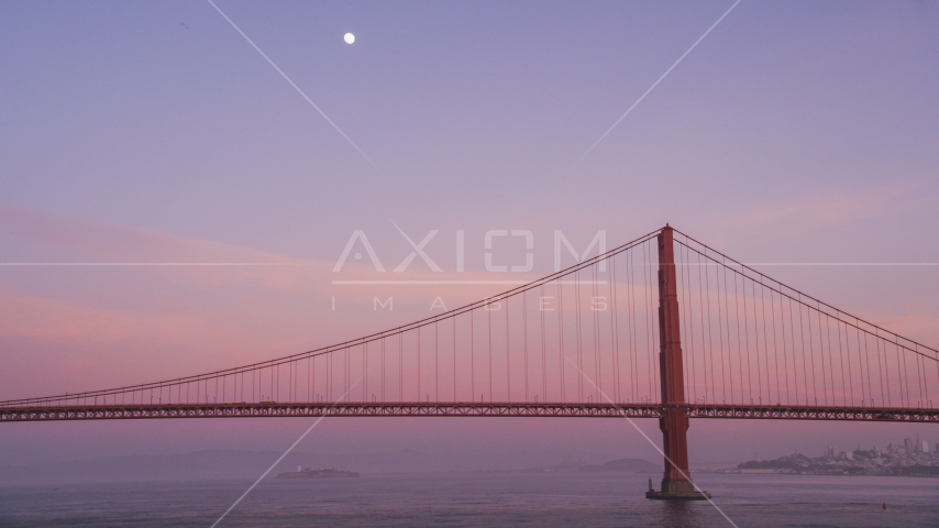 The moon above the Golden Gate Bridge at twilight in San Francisco, California Aerial Stock Photo DCSF10_030.0000481 | Axiom Images