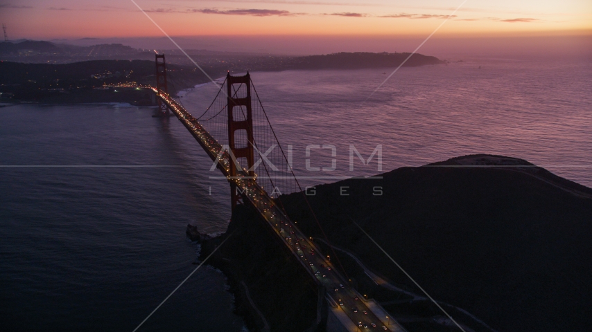 Heavy traffic crossing the Golden Gate Bridge, San Francisco, California, twilight Aerial Stock Photo DCSF10_050.0000000 | Axiom Images