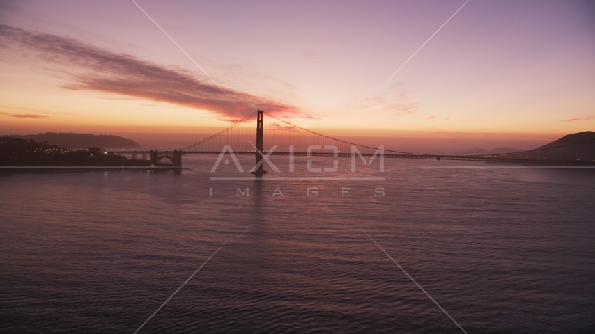 A view of the south end of the Golden Gate Bridge, San Francisco Bay, California, twilight Aerial Stock Photo DCSF10_052.0000000 | Axiom Images