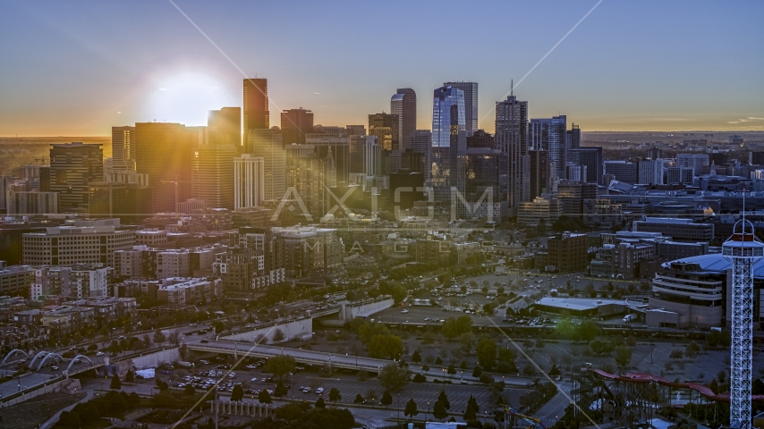 Sun rising behind the city's skyline in Downtown Denver, Colorado Aerial Stock Photo DXP001_000094 | Axiom Images