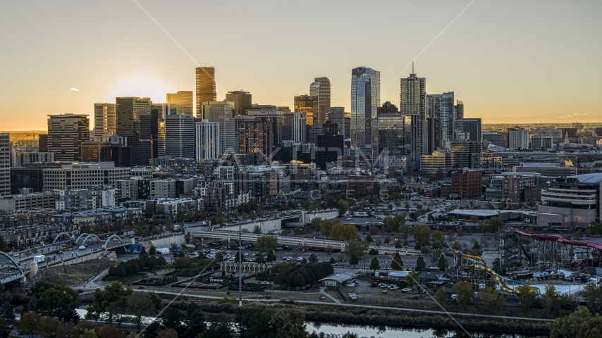 Bright sun rising behind the city's skyline in Downtown Denver, Colorado Aerial Stock Photo DXP001_000097 | Axiom Images