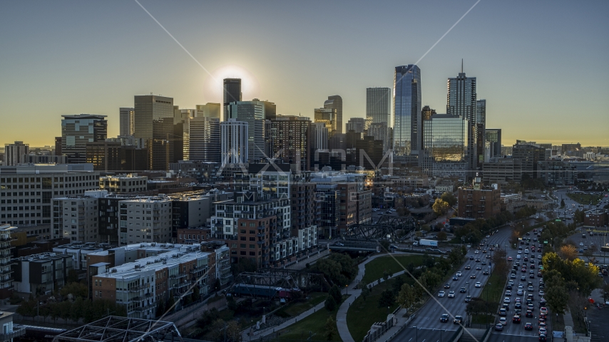 Skyscrapers of the city's skyline at sunrise, viewed from a park in Downtown Denver, Colorado Aerial Stock Photo DXP001_000109 | Axiom Images