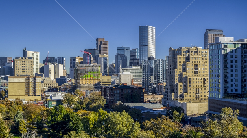 City skyline's tall skyscrapers behind office buildings, Downtown Denver, Colorado Aerial Stock Photo DXP001_000132 | Axiom Images