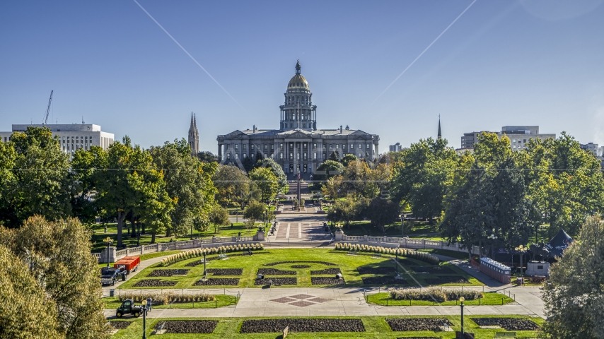 The Colorado State Capitol building seen from low over Civic Center Park in Downtown Denver, Colorado Aerial Stock Photo DXP001_000142 | Axiom Images