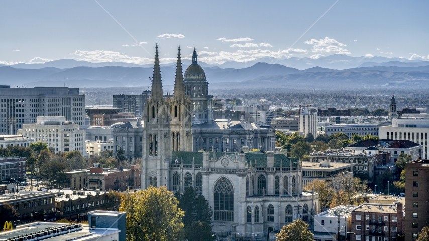 A cathedral with mountains in the distance, Downtown Denver, Colorado Aerial Stock Photo DXP001_000169 | Axiom Images