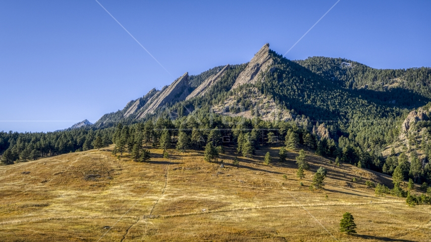 Green Mountain and flatirons behind a tree-topped hill, Rocky Mountains, Colorado Aerial Stock Photo DXP001_000194 | Axiom Images