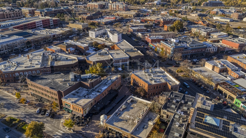 Brick office buildings and shops around a quiet intersection in Fort Collins, Colorado Aerial Stock Photo DXP001_000232 | Axiom Images