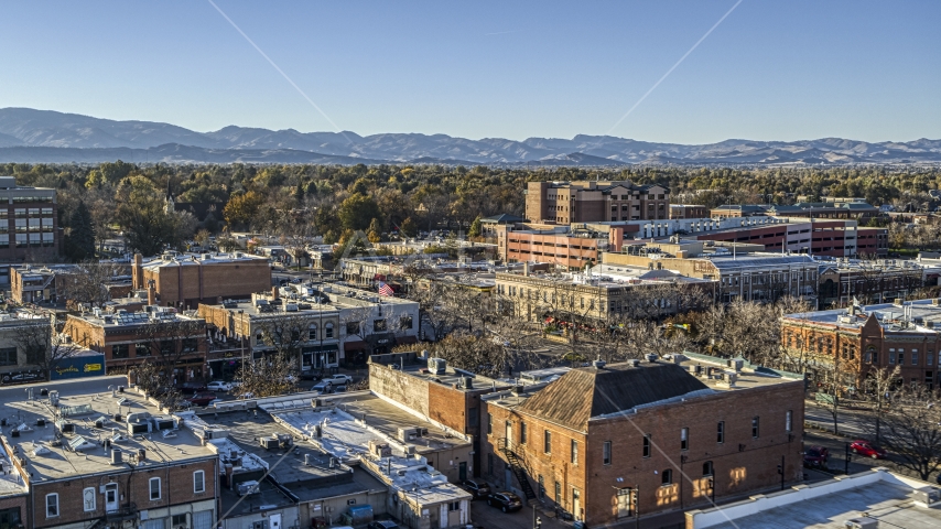 A view across the tops of brick office buildings in Fort Collins, Colorado Aerial Stock Photo DXP001_000239 | Axiom Images