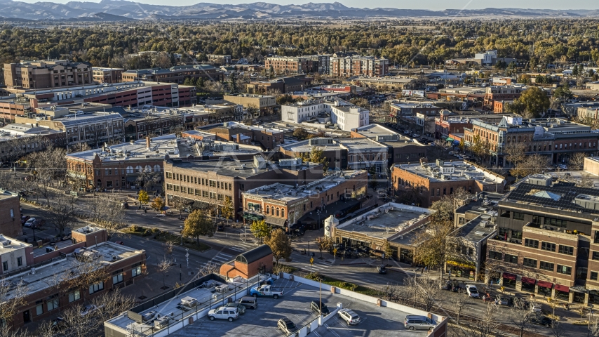 A view across town at brick office buildings and shops in Fort Collins, Colorado Aerial Stock Photo DXP001_000246 | Axiom Images