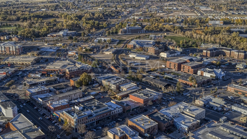 Brick office buildings and small shops near railroad tracks in Fort Collins, Colorado Aerial Stock Photo DXP001_000248 | Axiom Images