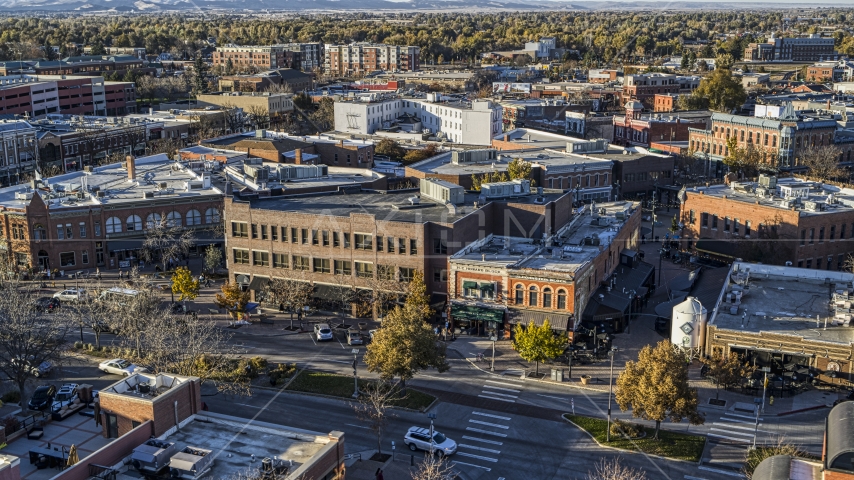 A brick office building and shop beside a town road in Fort Collins, Colorado Aerial Stock Photo DXP001_000253 | Axiom Images