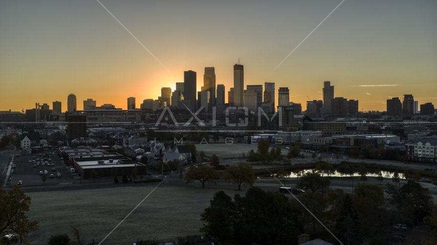 The rising sun behind tall skyscrapers in the city's skyline in Downtown Minneapolis, Minnesota Aerial Stock Photo DXP001_000259 | Axiom Images
