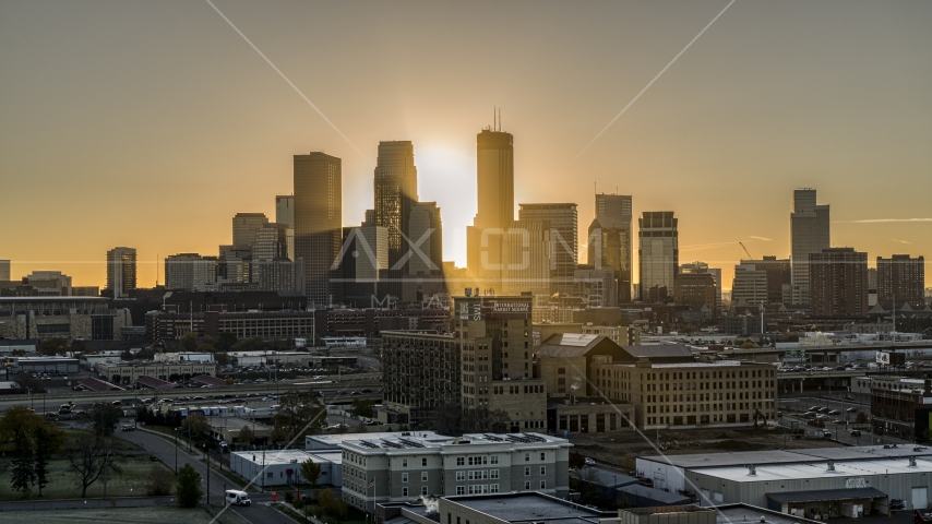 The rising sun beyond towering skyscrapers in the city's skyline in Downtown Minneapolis, Minnesota Aerial Stock Photo DXP001_000262 | Axiom Images