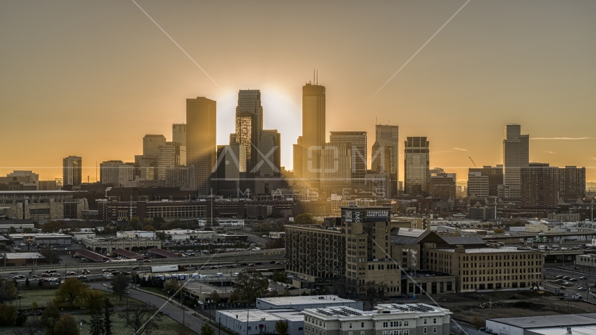 The sun rising beyond towering skyscrapers in the city's skyline in Downtown Minneapolis, Minnesota Aerial Stock Photo DXP001_000263 | Axiom Images