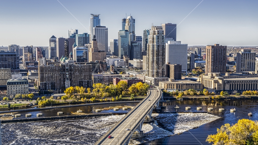 The city skyline on the other side of a bridge spanning the Mississippi River, Downtown Minneapolis, Minnesota Aerial Stock Photo DXP001_000293 | Axiom Images