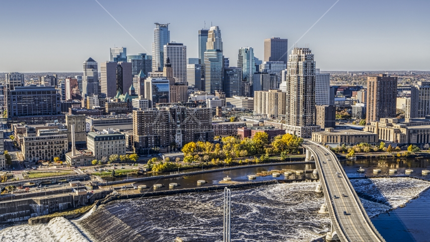 The city skyline on the opposite side of a bridge spanning the Mississippi River, Downtown Minneapolis, Minnesota Aerial Stock Photo DXP001_000294 | Axiom Images