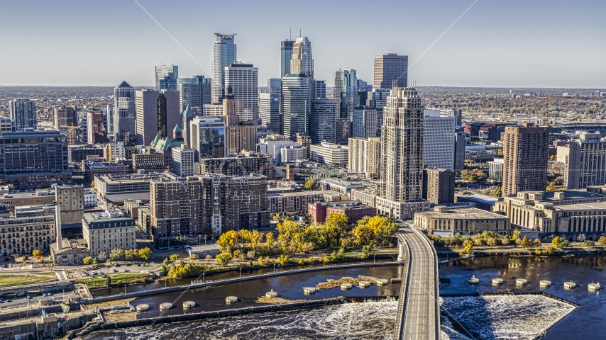 The city skyline on the opposite side of a bridge crossing the Mississippi River, Downtown Minneapolis, Minnesota Aerial Stock Photo DXP001_000295 | Axiom Images